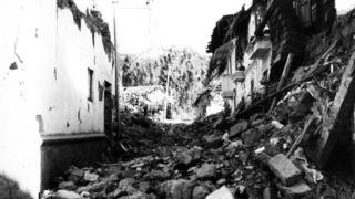 View of destroyed adobe houses in Huaraz