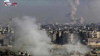 Screen grab from video provided by the Aleppo News Network shows smoke rising following an air strike that hit insurgents positions in eastern neighbourhoods of Aleppo, Syria, on 9 December 2016.