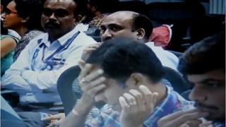 Television footage from Indian Space Research Organisation shows a depressed Scientist as India's first mission Moon Project became Failure after a long wait . Indias space agency lost contact with the Vikram lander around 2.1 km over the lunar surface .