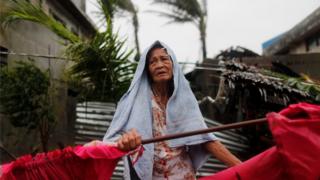 A Filipino elderly woman is seen in the typhoon-hit town of Aparri, Cagayan province, Philippines, 15 September 2018.