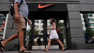 People walk past a Nike store in New York City, New York, U.S., September 4, 2018.