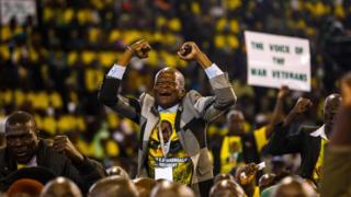 Zimbabwe War veterans sing and dance ahead of a consultative meeting between the veterans of Zimbabwe"s liberation war and leaders of Zimbabwe ruling party Zimbabwe African National Union Patriotic Front (ZANU PF) in Harare on May 11, 2018.