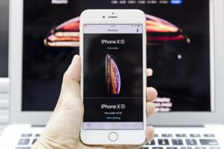 A man using an Apple Store app to pre order the new iPhone Xs on September 14 2018 in Hong Kong, Hong Kong.