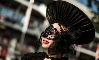An albino model in a black hat the Durban July race event, Durban , South Africa - Friday 6 July 2018