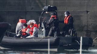 Border Force officers bring to shore men thought to be migrants in Dover on Thursday 7 May