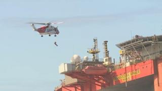 Salvor lowered onto stricken rig