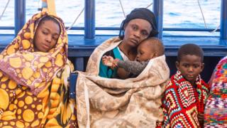 Migrants rescued by Spanish rescue ship Aita Mari rest on Sunday after their ordeal.