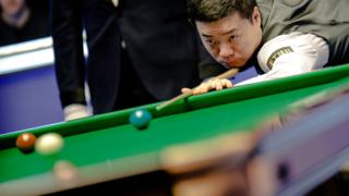 Ding Junhui of China plays a shot in the first round match against Mark Allen of Northern Ireland on day 1 of the 2023 MrQ UK Championship at York Barbican on November 25, 2023 in York, England.