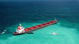 Fuel oil leaks from the Shen Neng 1, a Chinese-registered bulk coal carrier grounded in the Great Barrier Reef Marine Park on April 4, 2010