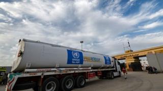 A truck of the UN Relief and Works Agency for Palestine Refugees (UNRWA) carrying fuel arrives at the Egyptian side of the Rafah border crossing with Gaza