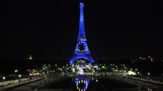 The Eiffel Tower lit up with the EU flag