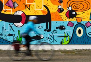 Cyclist and mural