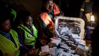  An Election Official Opens an Urn When Counting Votes at a Polling Station for the General Election in the Mbare Suburb of Zimbabwe 