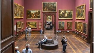 museum visitors wearing face masks