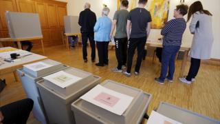 Voters stand at the European elections in a polling station in Gamshurst near Achern, Germany, 26 May 2019