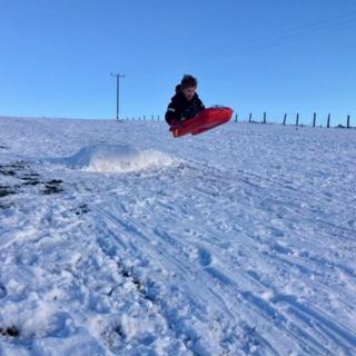 Child on sledge