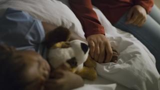 Parent with sleeping child