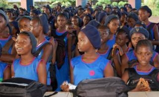 Sierra Leonean children attend the first day of the new school year on September 17, 2018, at the Freetown secondary shcool, after the government launched a programme of free primary and secondary education