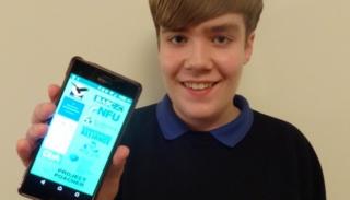 Aaron Christiansen with the app on his phone
