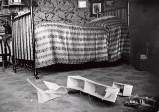 A photo of Lartigue's bedroom with a toy plane on the floor