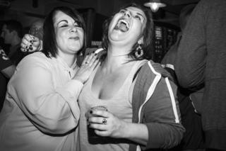Two supporters enjoy the game