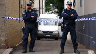 Police cordon off a small alley where officers searched a property after Australian counter-terrorism police arrested four people in raids late on Saturday across several Sydney suburbs, 3 August 2017