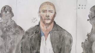 This file court drawing made on June 26, 2014, shows Mehdi Nemmouche (C), the 29-year-old suspected gunman in a quadruple murder at the Brussels Jewish Museum, during a court hearing in Versailles, France