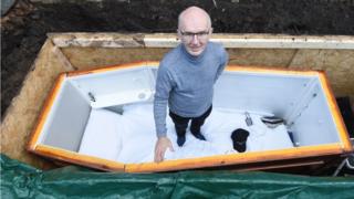 John Edwards posed in his coffin before he was buried alive