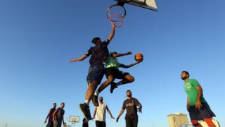 Young men play basketball - Monday 27 May 2019