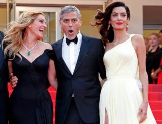 Cast members Julia Roberts, George Clooney and his wife Amal Clooney pose on the red carpet