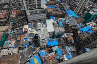 A aerial view showing rescuers at the site of collapsed building in Dongri area of Mumbai, India, 17 July 2019