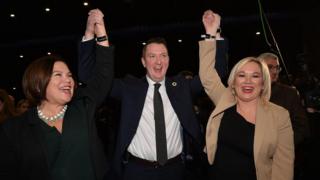 John Finucane celebrates with Sinn Féin leader Mary Lou McDonald and deputy leader Michelle O'Neill