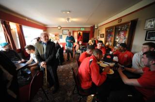 Stamford players gather in the bar