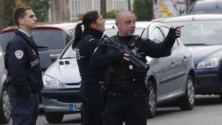 Police officers patrol near the school in Aubervilliers
