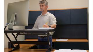 Man using stand-up desk