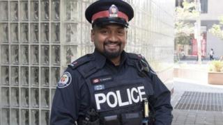 Toronto police Constable Niran Jeyanesan, who bought a teenager a shirt and tie he tried to steal for a job interview