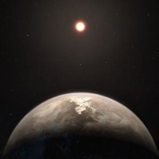 Ilustración artística del exoplaneta Ross 128 y su estrella enana roja
