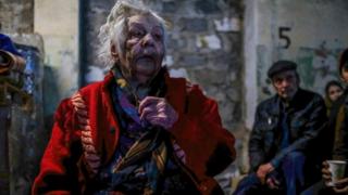 An injured woman seen inside the center for distribution of humanitarian aid in Severodonetsk