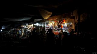 Generators provide some light during power cut in Karachi. 7 July 2015