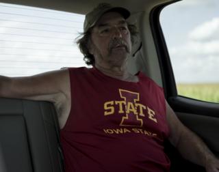 A man in the back of the car