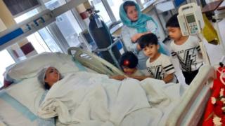 Saba Sahar lies in a hospital bed