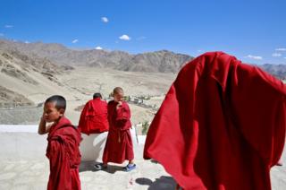 Young monks take a break from their studies inside Thiksey Monastery in Ladakh, India.