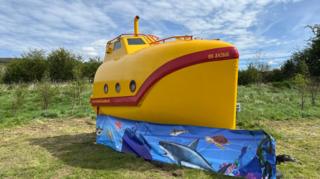 Submarine in field on glamping site at Cheddar