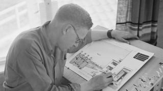 Carl Giles (1916 - 1995) at work in his studio on his farm in Suffolk, June 1948.
