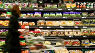 Woman shopping in Sainsbury's - blurred image