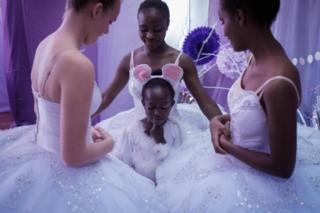 Members of Dance Centre Kenya (DCK) speak before the start of a production of at the National Theatre in Nairobi, Kenya - Saturday 1 December 2018
