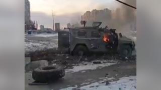 A screen grab captured from a video shows a Russian armoured vehicle burning after it was destroyed by Ukrainian forces in Kharkiv, Ukraine, on 27 February 2022