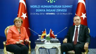 A handout picture provided by Turkish President Press office shows Turkish President Recep Tayyip Erdogan (R) and German Chancellor Angela Merkel (L) sit for a bilateral at World Humanitarian Summit, in Istanbul, Turkey, 23 May 2016.