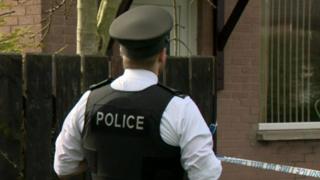 Police officer outside a house in Limavady