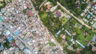 Aerial photo of large colonial residences in Oyster Bay, South Africa and neighbouring poor settlement